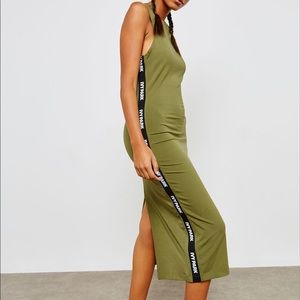 Ivy Park: Long green athletic dress with logo on both sides. Size extra small